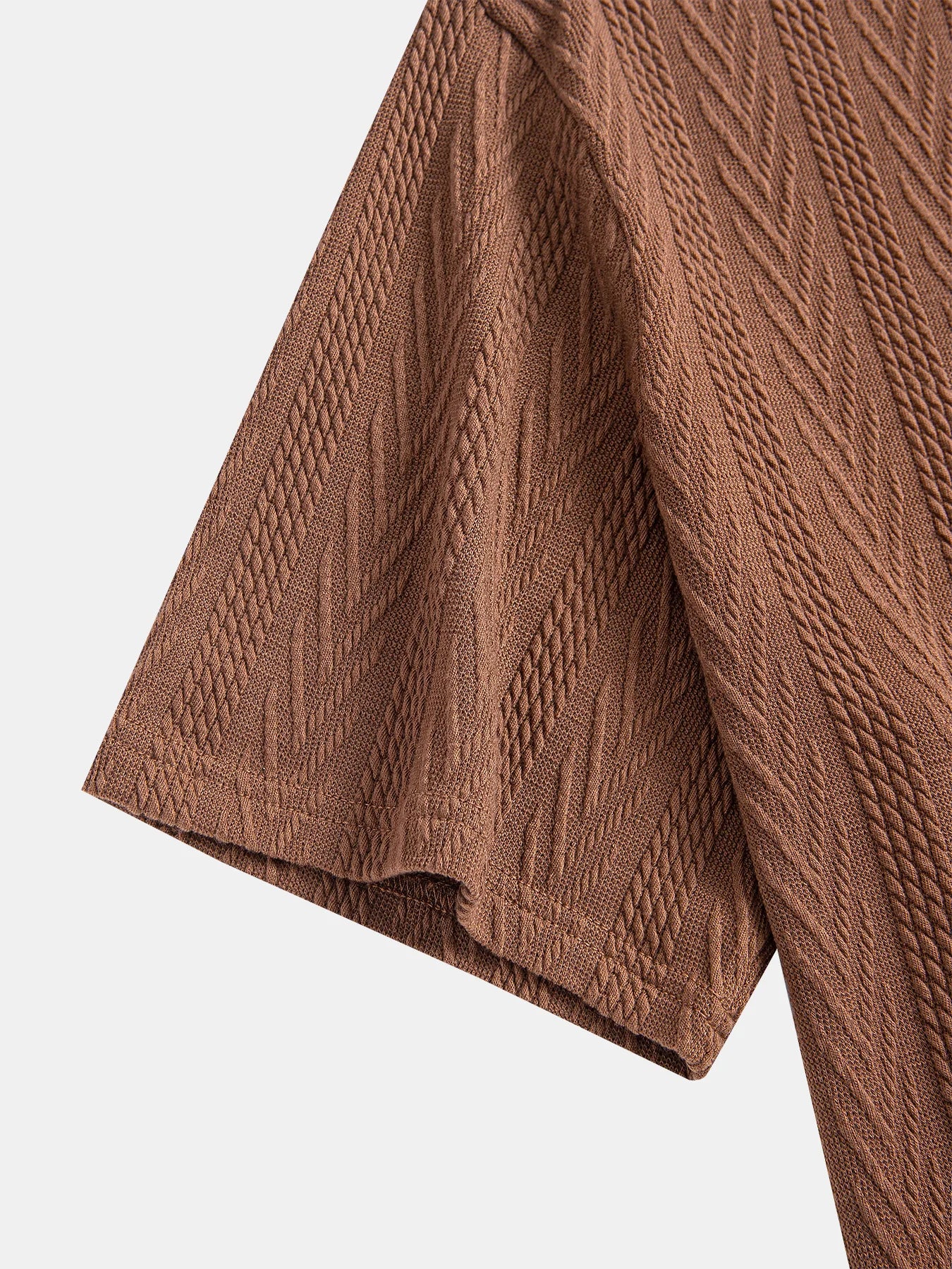 Coffee polo shirt with soft chevron knit and short rolled sleeves — discreetly elegant for everyday use.