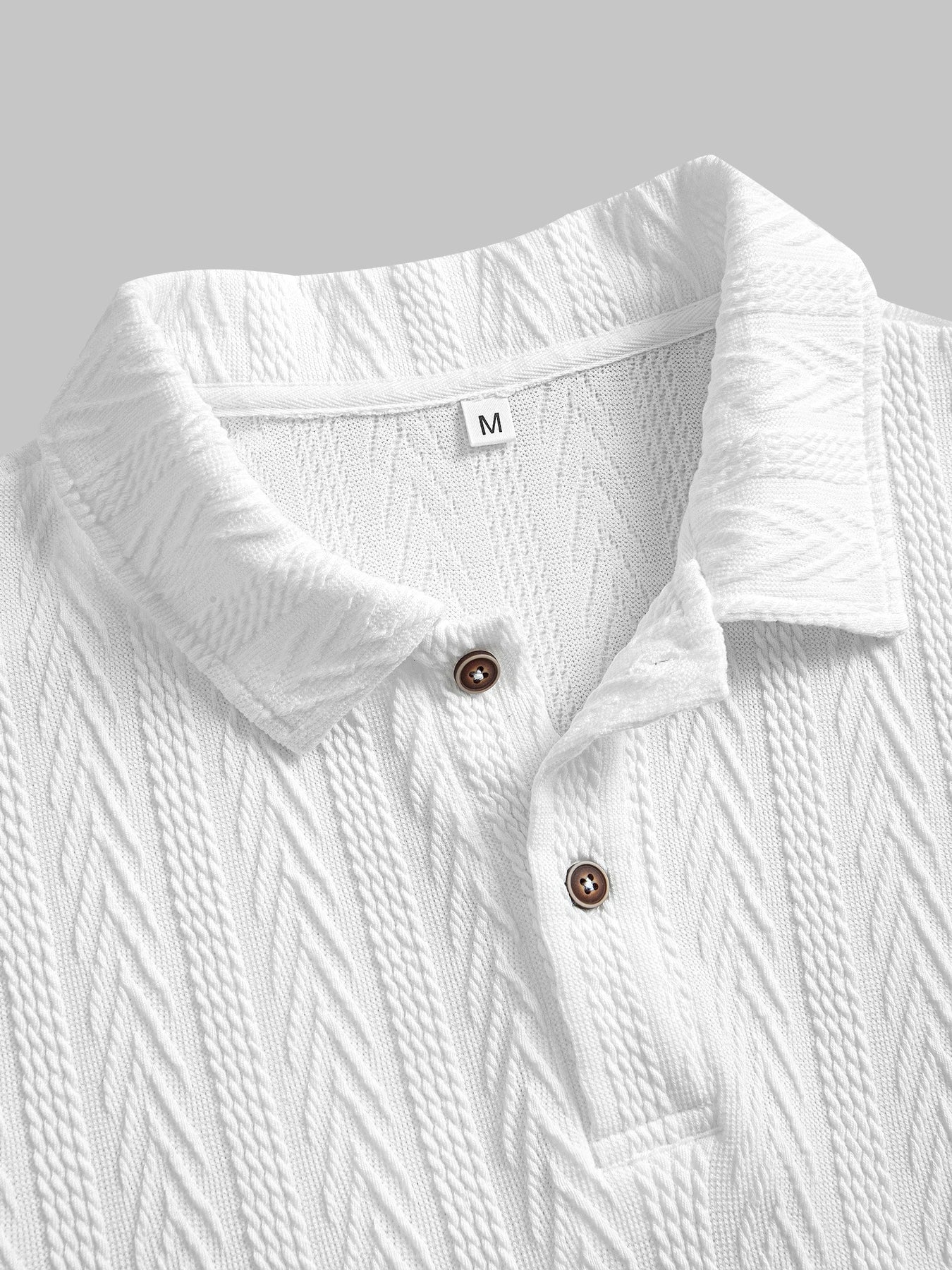 White knit polo shirt with chevron texture, short rolled sleeves and structured collar — understated silhouette for clean summer dressing.