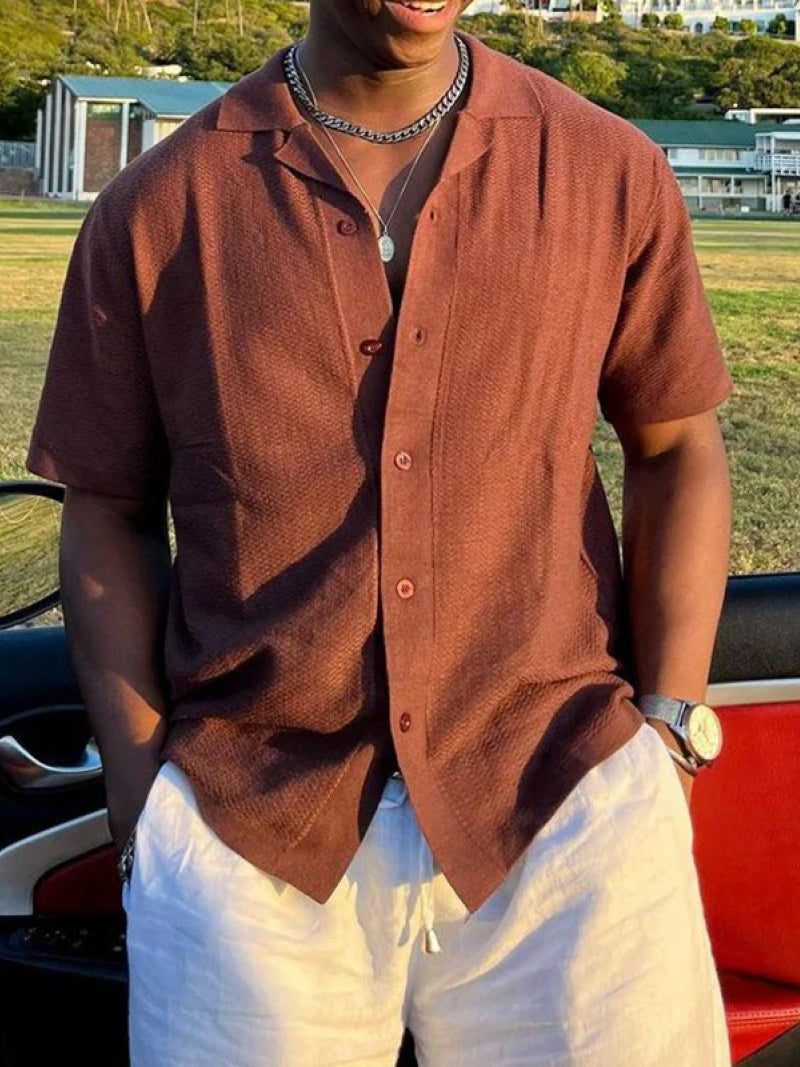 Terracotta Cuban collar shirt with quarter zip and soft knit texture — lightweight structure for summer refinement.