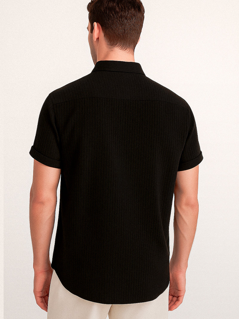 Black short sleeve t-shirt with front button-up fastening and textured surface — understated elegance for refined casual looks