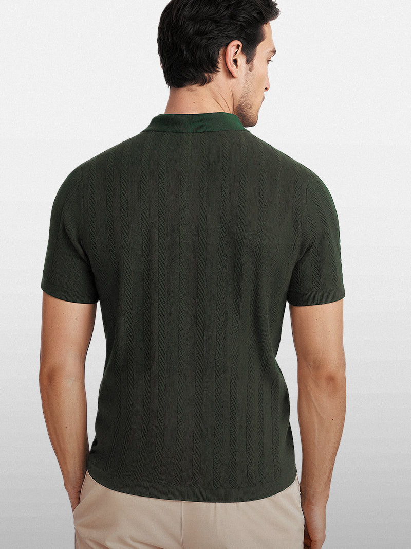 Dark green knit polo shirt with front zipper and structured collar — breathable lightweight design with quiet authority.