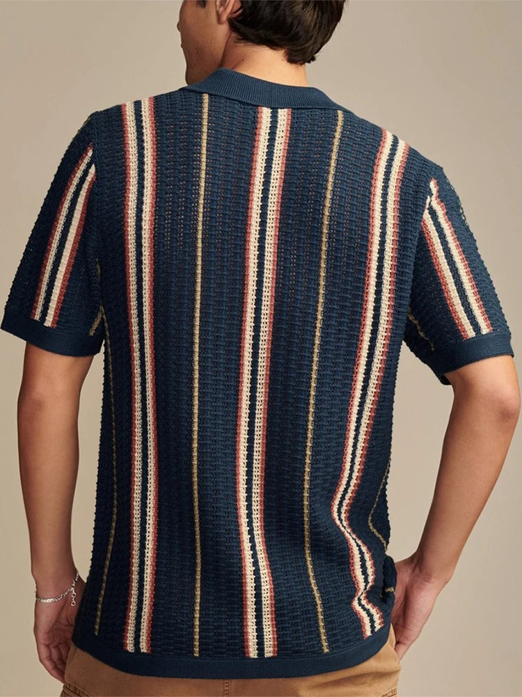 Dark blue striped knit shirt with turn-down collar and soft drape — casual structure with understated refinement for warm seasons.