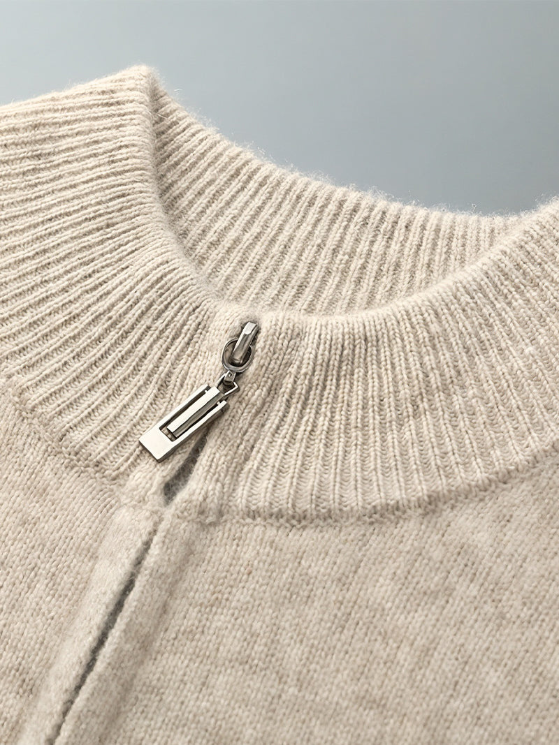 Natural beige merino wool sweater with central zipper, ribbed neckline and soft knit texture — refined layers for colder days with timeless elegance.