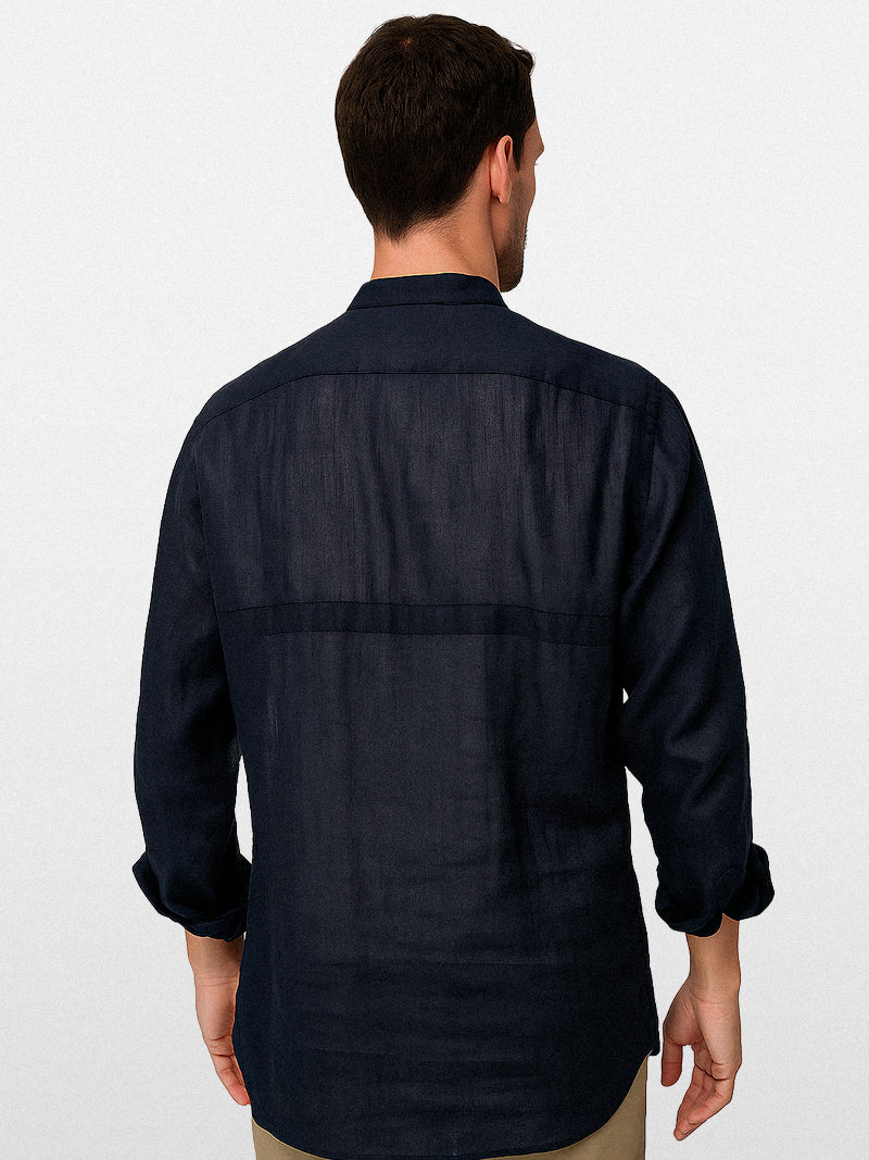 Navy linen shirt with a modern band collar, front double pockets and relaxed silhouette — refined texture and silent elegance for everyday presence.