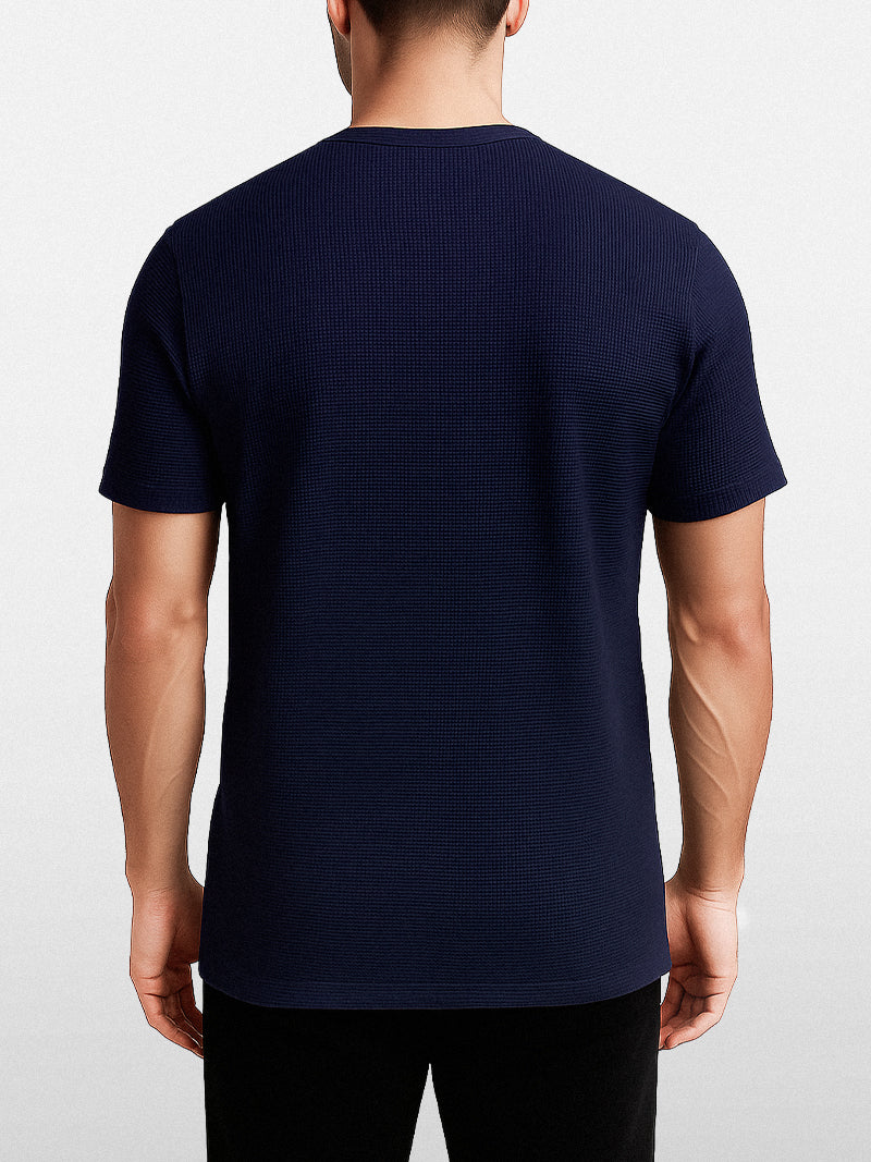 Navy blue short sleeve t-shirt with solid knit texture and clean O-neck — understated fit for quiet everyday elegance.