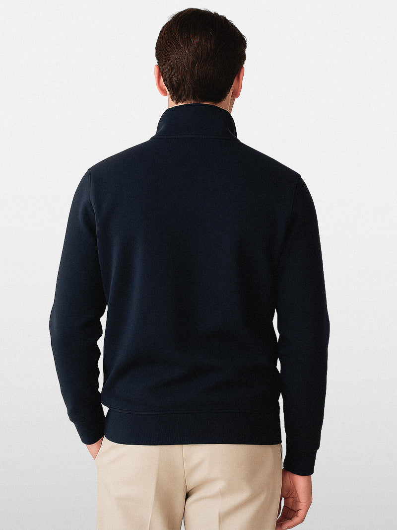 Navy blue zip-up sweater with stand-up collar and soft knit lining — midweight layer designed for quiet structure and modern elegance.