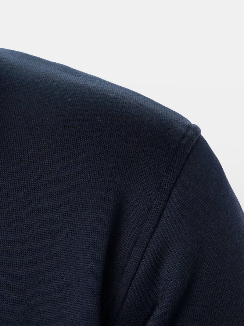 Navy blue zip-up sweater with stand-up collar and soft knit lining — midweight layer designed for quiet structure and modern elegance.