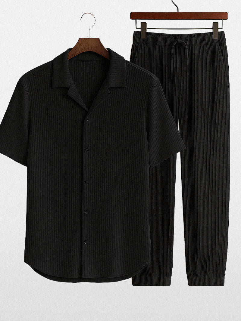 Black striped two-piece set for men with breathable short sleeve shirt and relaxed pants — discreet elegance in a structured silhouette.