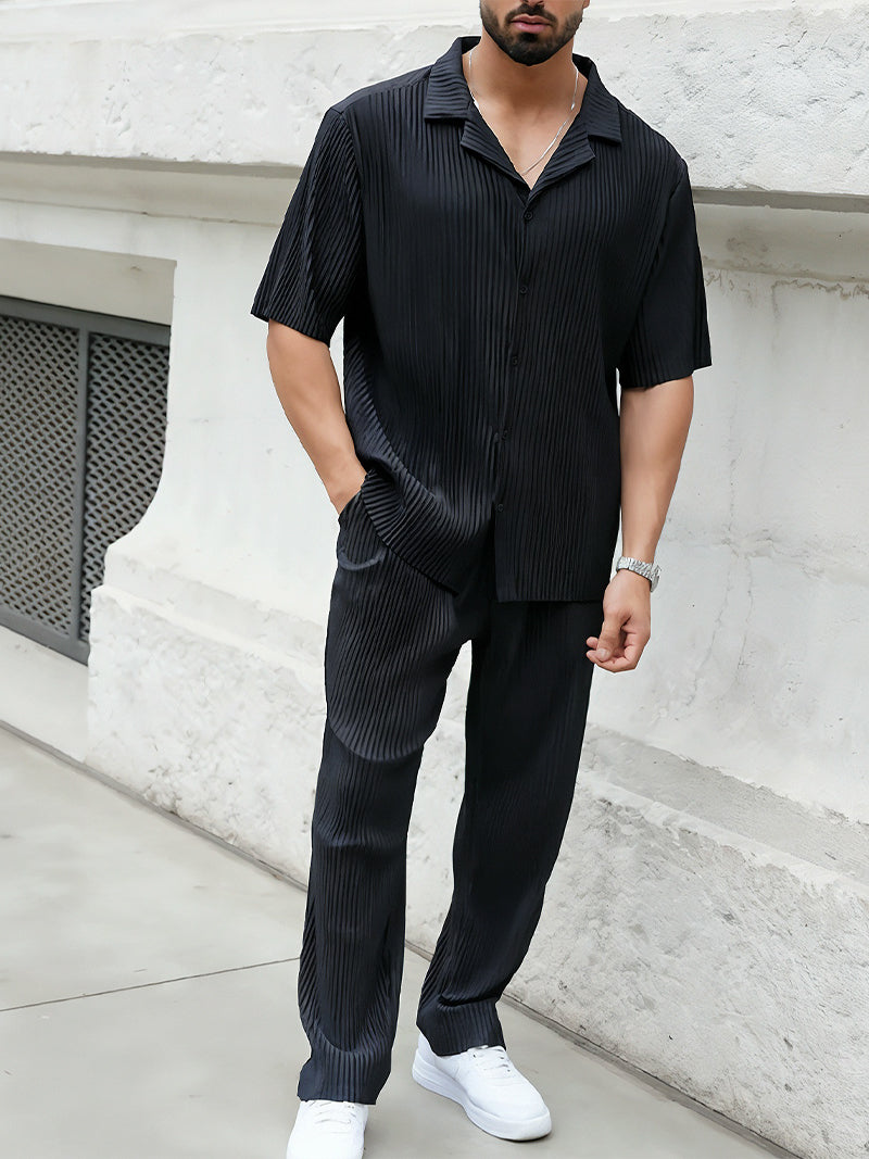 Black striped two-piece set for men with breathable short sleeve shirt and relaxed pants — discreet elegance in a structured silhouette.