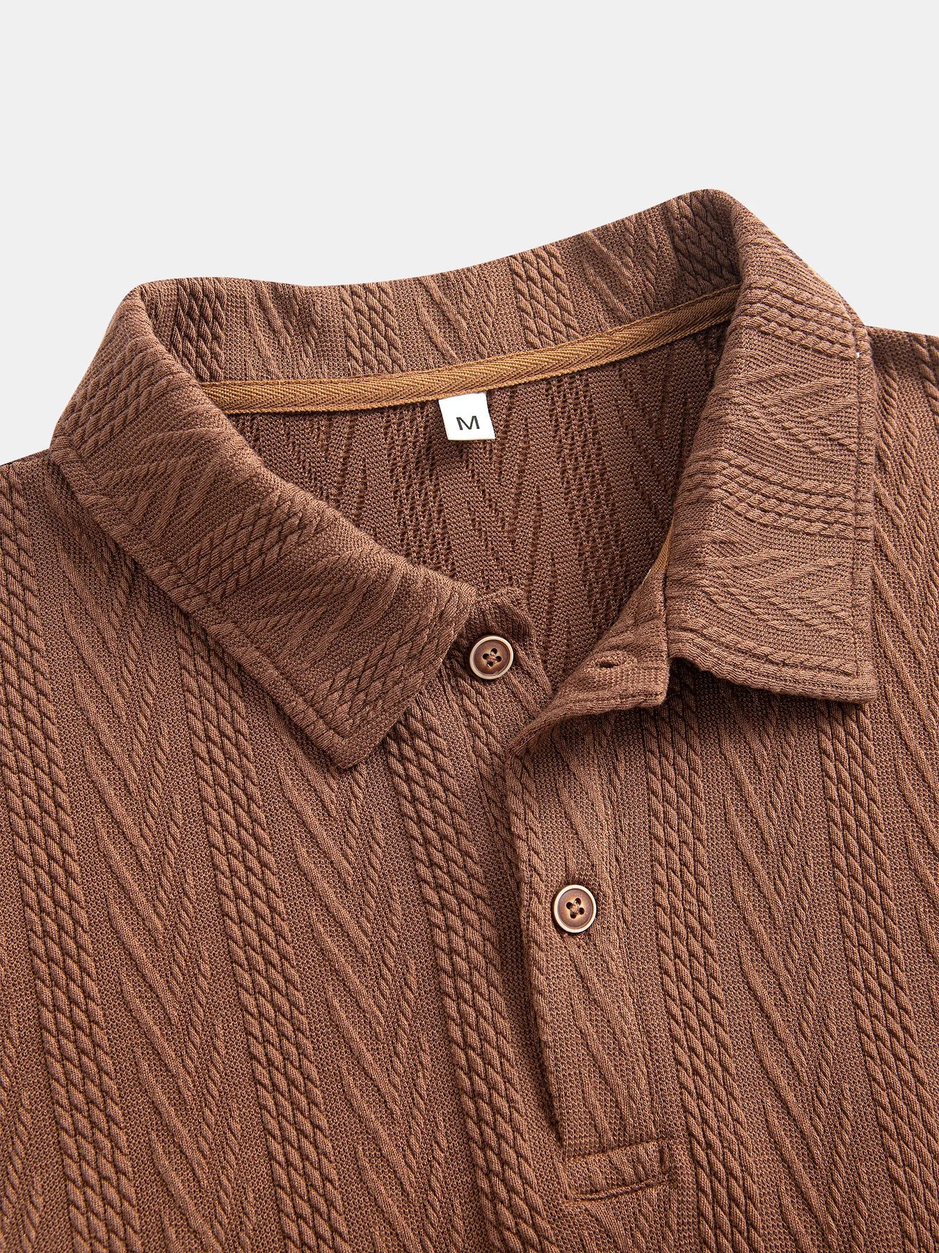 Coffee polo shirt with soft chevron knit and short rolled sleeves — discreetly elegant for everyday use.