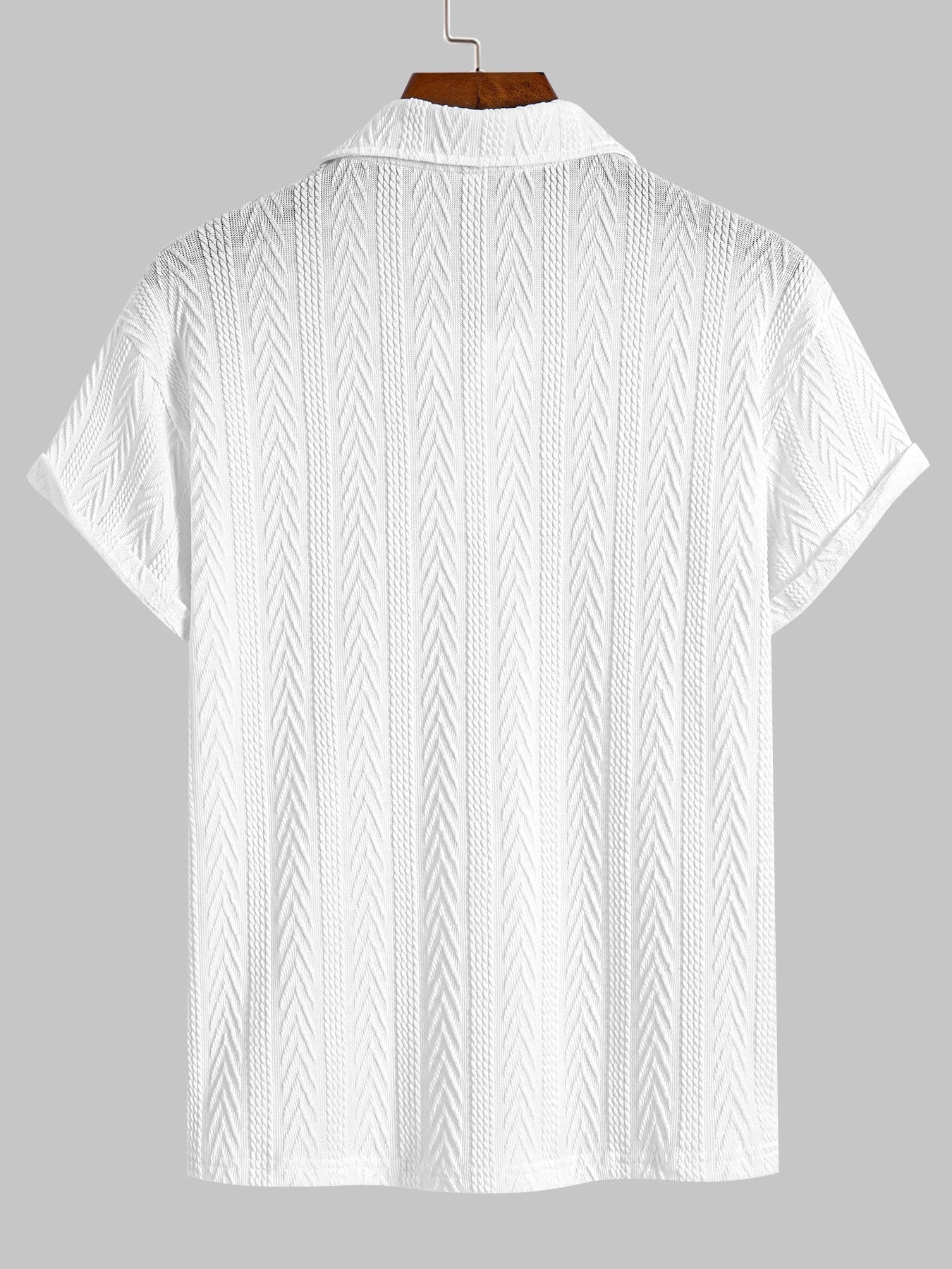 White knit polo shirt with chevron texture, short rolled sleeves and structured collar — understated silhouette for clean summer dressing.