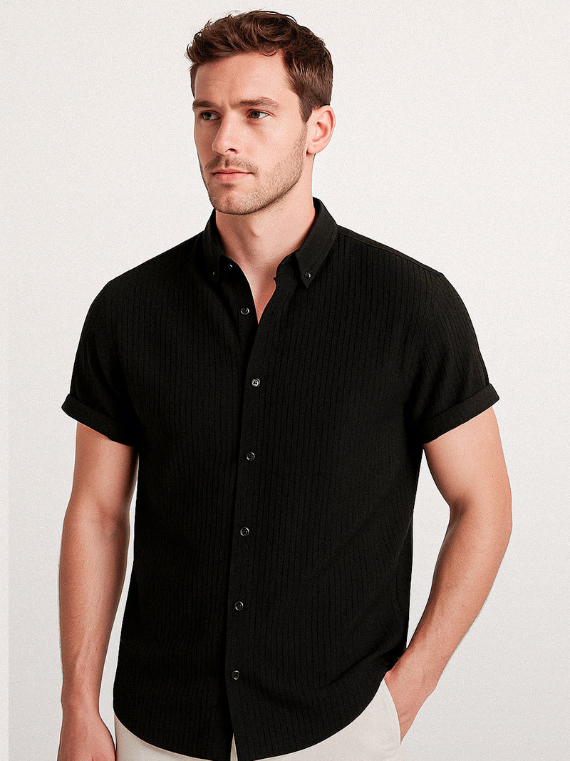 Black short sleeve t-shirt with front button-up fastening and textured surface — understated elegance for refined casual looks.