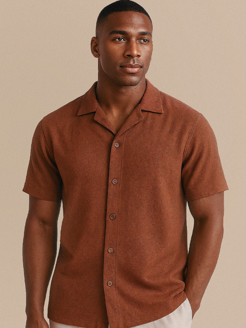Apricot knit polo shirt with front zipper and structured collar — refined summer layer with clean, relaxed form.