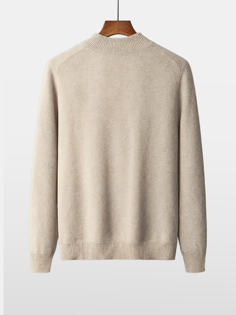 Natural beige merino wool sweater with central zipper, ribbed neckline and soft knit texture — refined layers for colder days with timeless elegance.