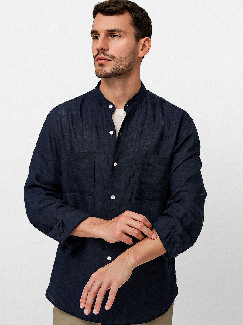 Navy linen shirt with a modern band collar, front double pockets and relaxed silhouette — refined texture and silent elegance for everyday presence.