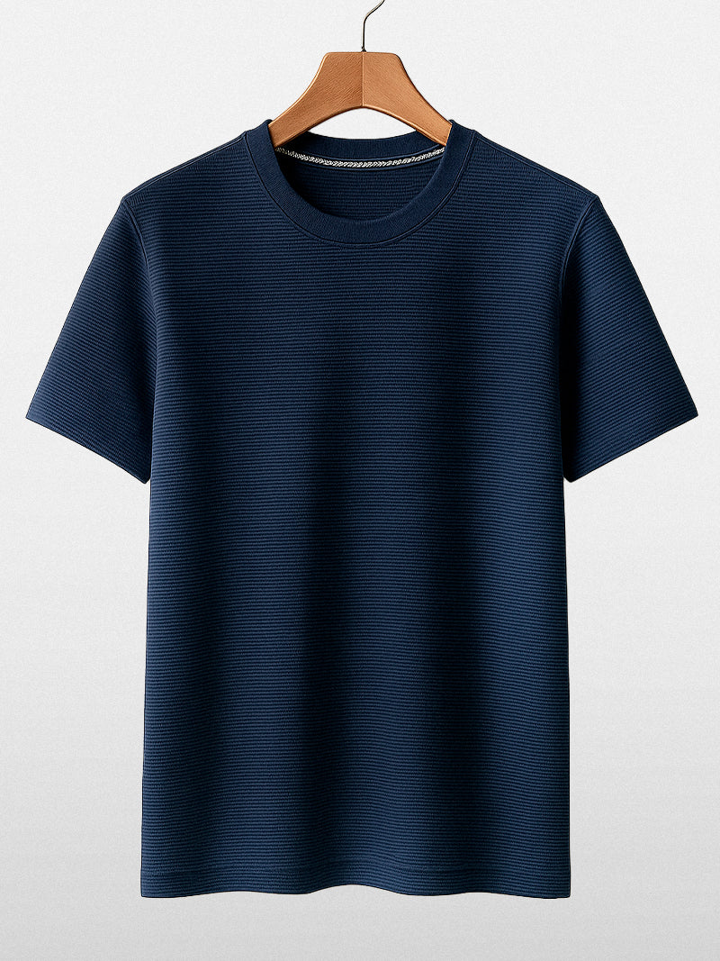 Navy blue short sleeve t-shirt with solid knit texture and clean O-neck — understated fit for quiet everyday elegance.