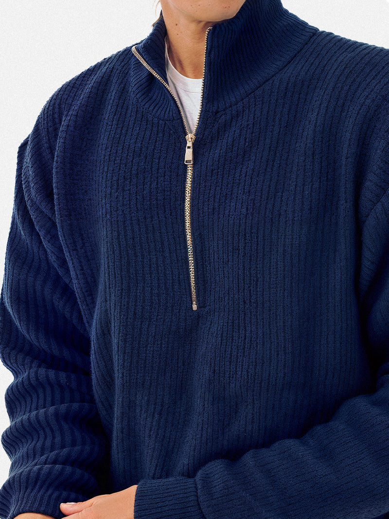 Navy blue sweater shirt with thick knit texture and minimalist structure — quiet layering option for cooler days.