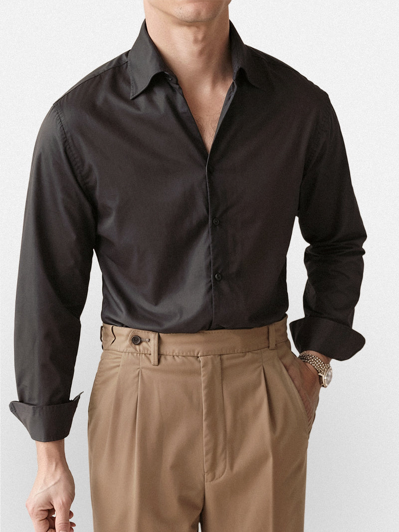 Black casual shirt with structured collar and smooth broadcloth finish — versatile staple with discreet presence.
