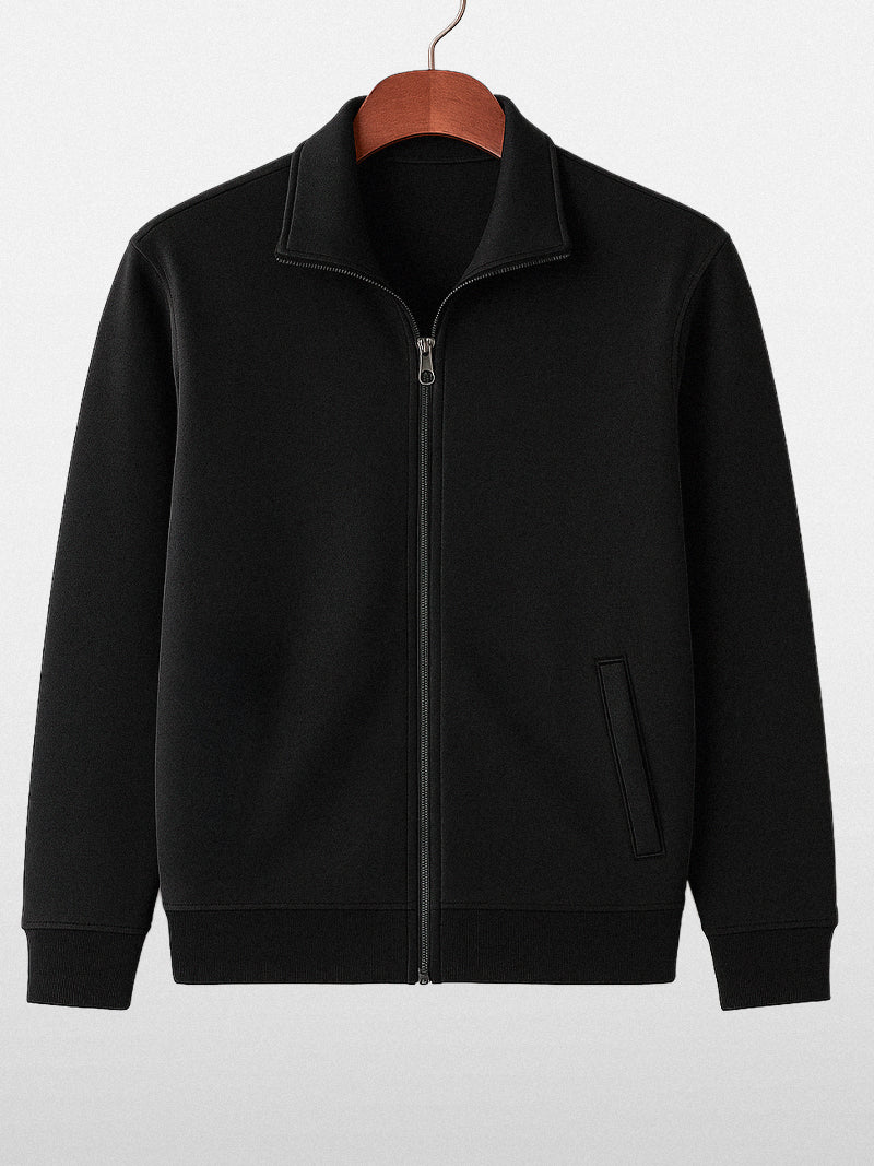 Black knitted zip sweater with structured collar and lined interior — versatile silhouette with subtle authority and discreet comfort.
