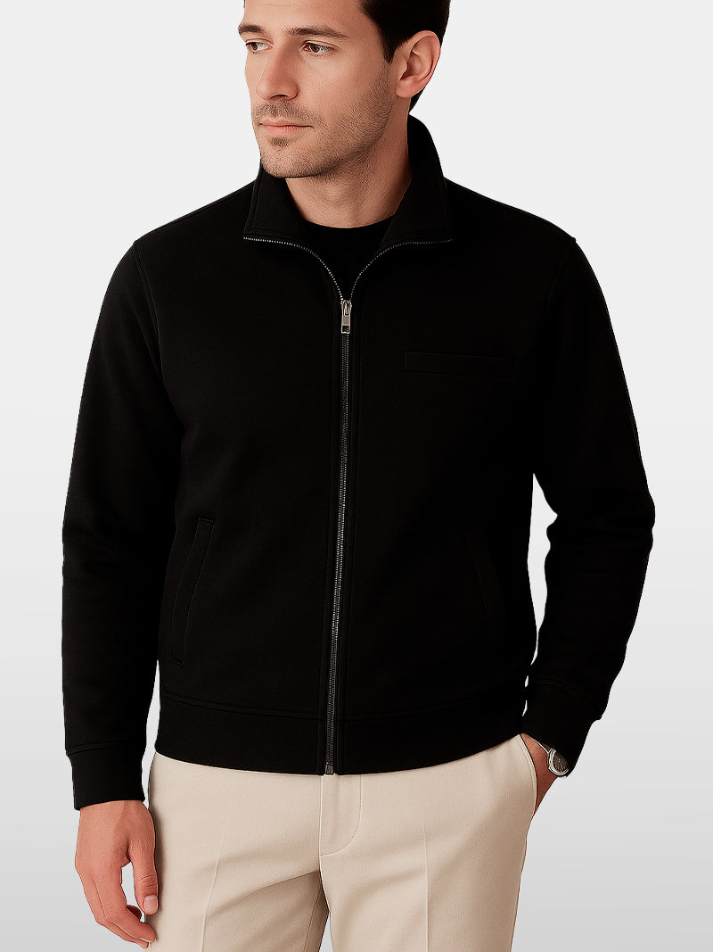 Black knitted zip sweater with structured collar and lined interior — versatile silhouette with subtle authority and discreet comfort.