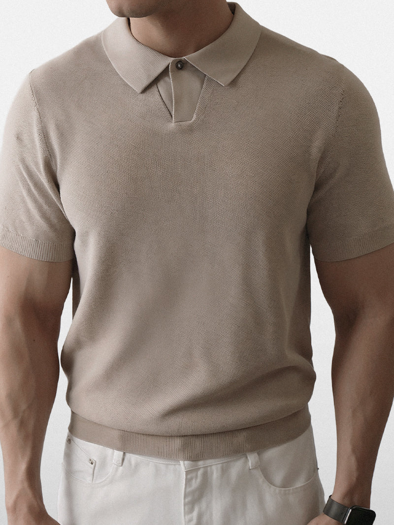 Apricot short sleeve polo with ribbed cuffs and compact knit — warm neutral tone with elegant fit.