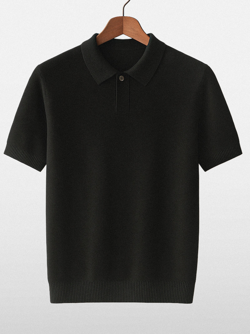 Black knit polo shirt with clean structure and subtle stretch — compact fabric and silent silhouette.